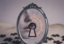 How to Decode Someone’s Hidden Insecurities Cracked mirror reflects eye through keyhole, puzzle pieces scattered.