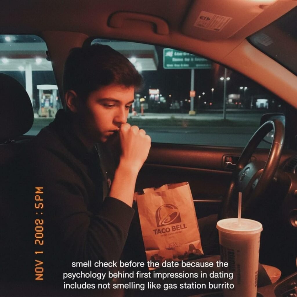 Man in car sniffing wrist with Taco Bell bag