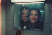 The Psychology Behind First Impressions in Dating Cracked mirror reflection with beer and phone number