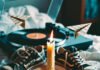 How to Rekindle a Relationship That’s Lost Its Spark? Vintage scene: melting candle on love letter, tangled sneakers, spinning vinyl, floating sheet-music planes.
