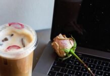 Online Dating Burnout: Signs & How to Recover Cracked iPhone with Hinge notifications, dead rose, latte.